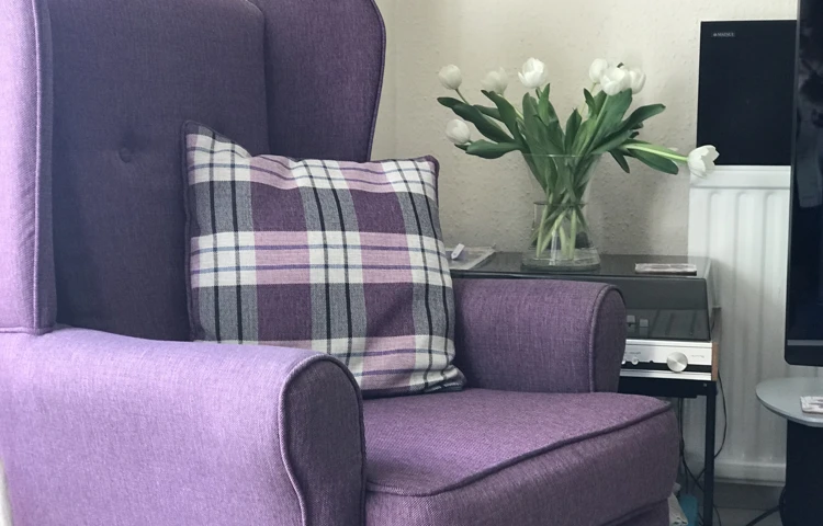 Purple chair and cushion for residents to relax in